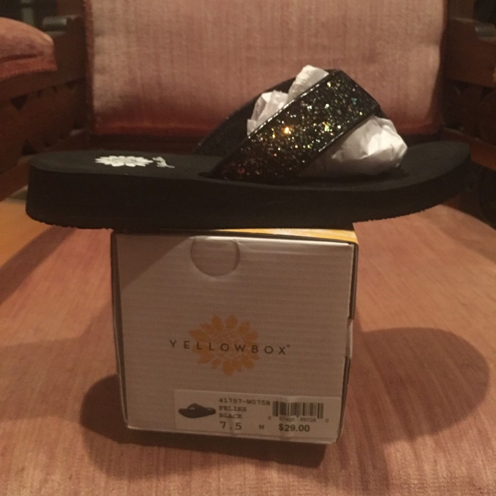Yellow box flip flops, black glitter